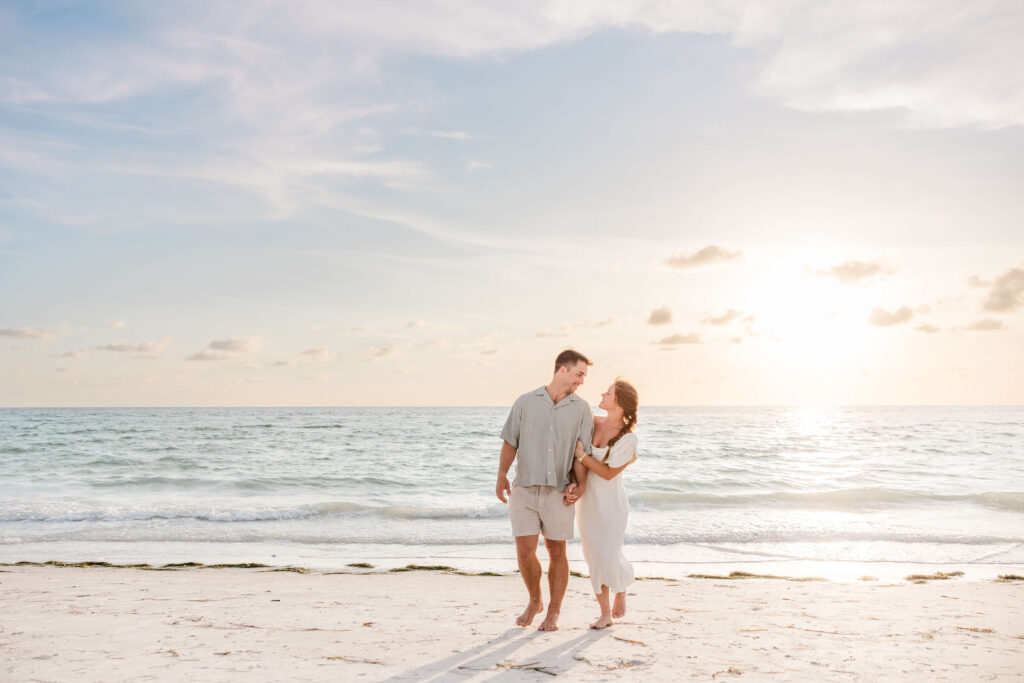 couple gets engaged photos taken on Pass-a-Grille Beach